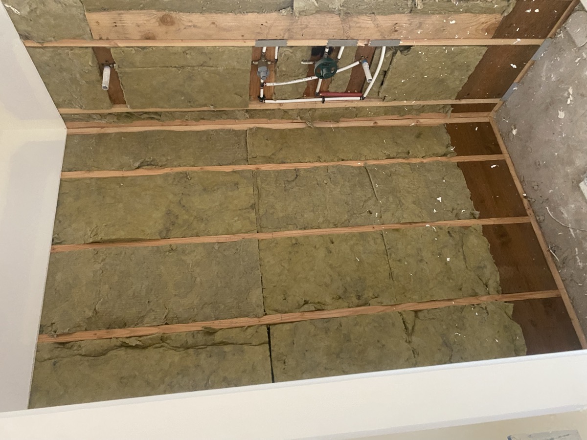 Bathroom opened to the studs with new plumbing rough-in