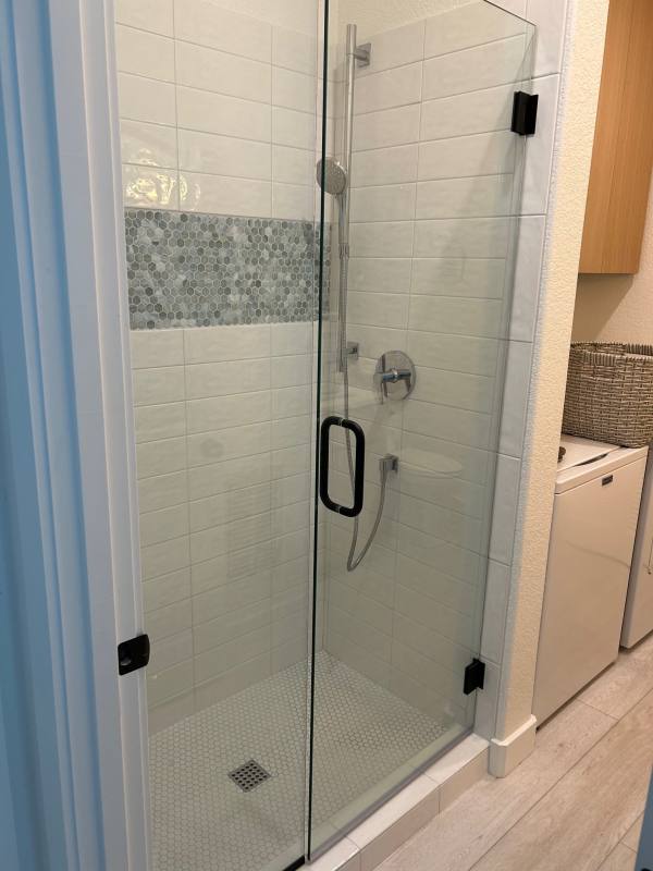 Finished tiled shower with frameless glass door