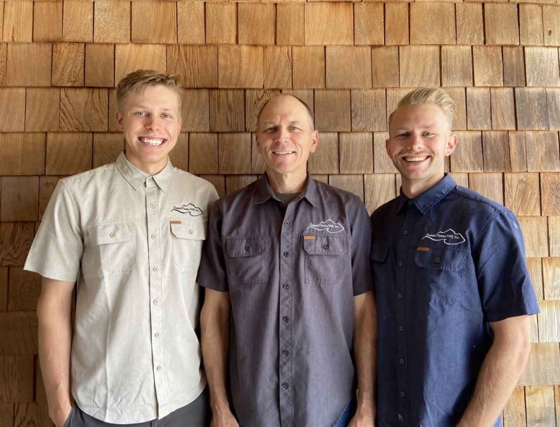 David and his two sons of Summit Homes NW, standing in front of cedar shingle siding